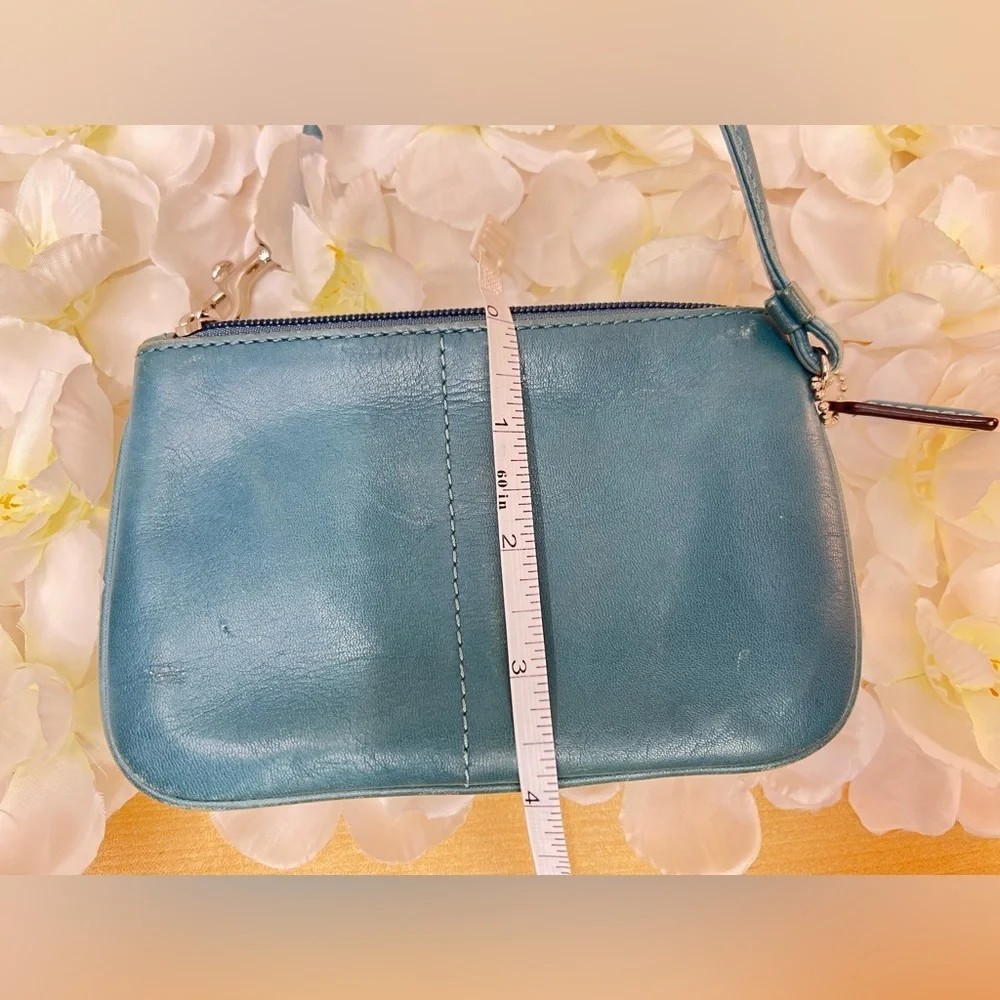 Coach Legacy Leather Small Wristlet. design is featured during Coach’s 65th